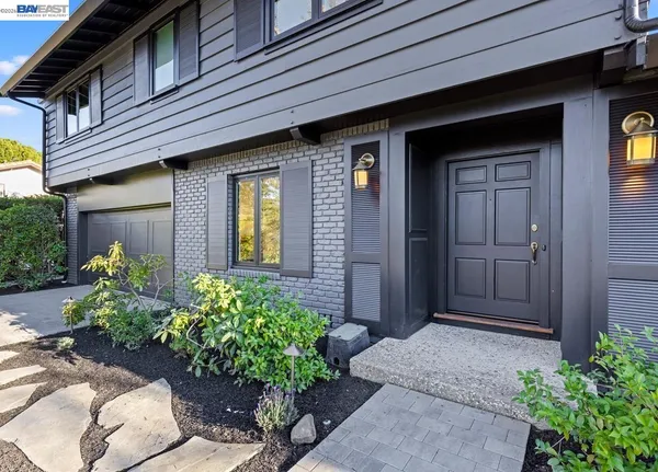 a kitchen with a sink and a large window