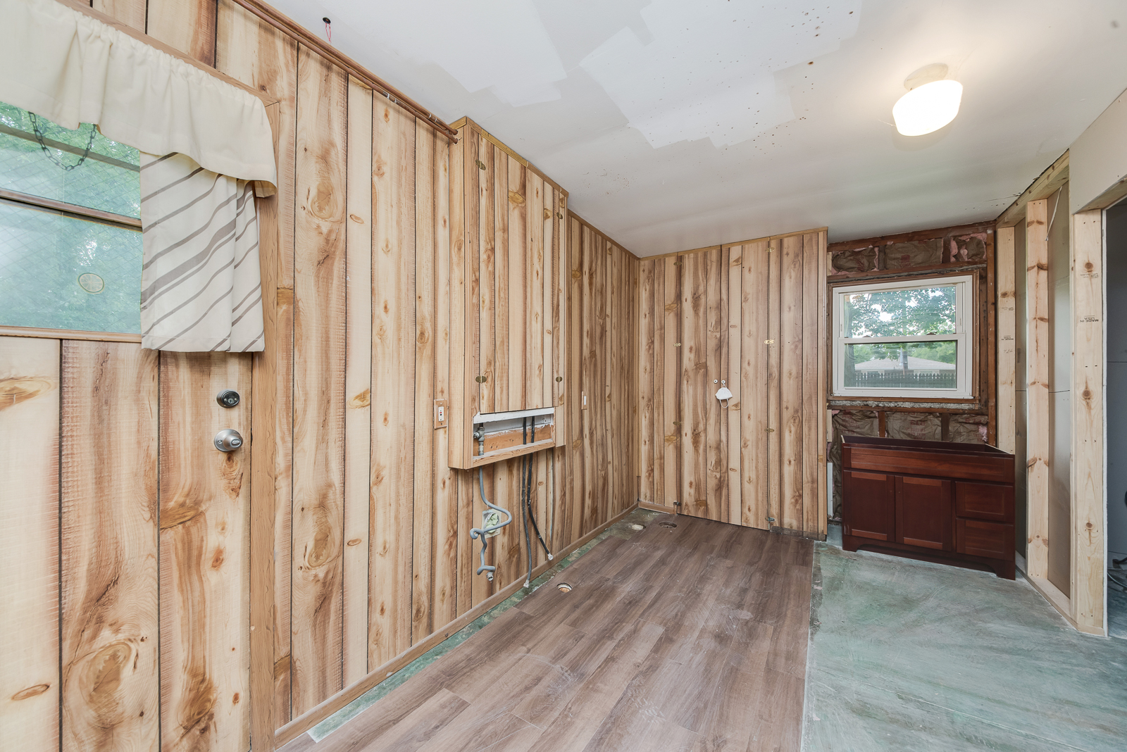 318 East North Street Lockport, IL 60441 - Photo 11 of 14 a view of a hallway with wooden floor and windows