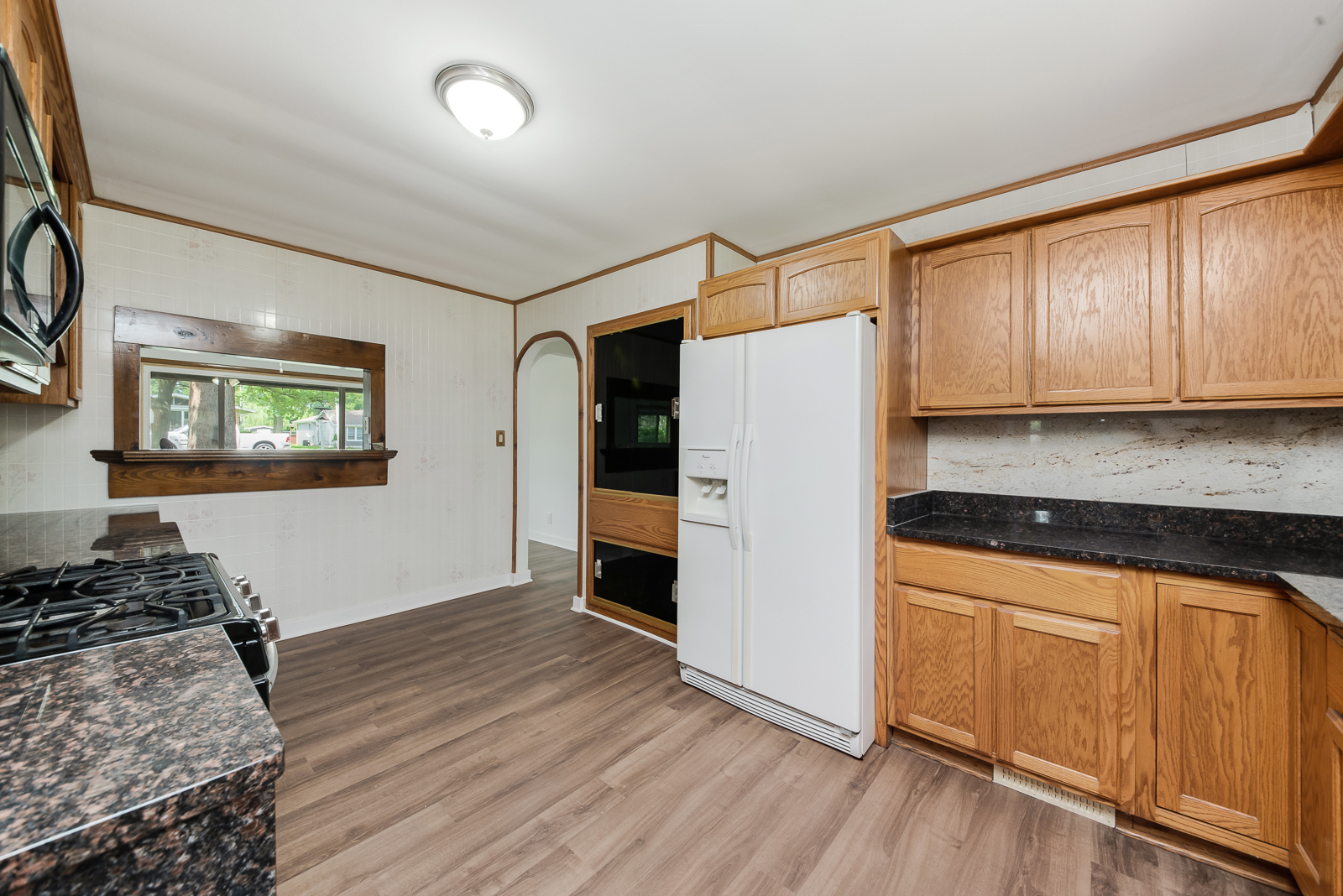 318 East North Street Lockport, IL 60441 - Photo 5 of 14 a kitchen with a refrigerator and a stove top oven