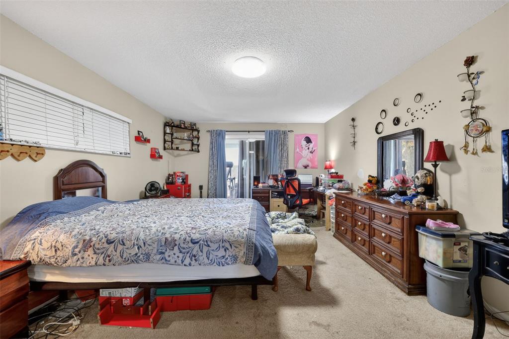 3010 Shepherd Road Mulberry, FL 33860 - Photo 16 of 28 a bed room with a bed and a couch