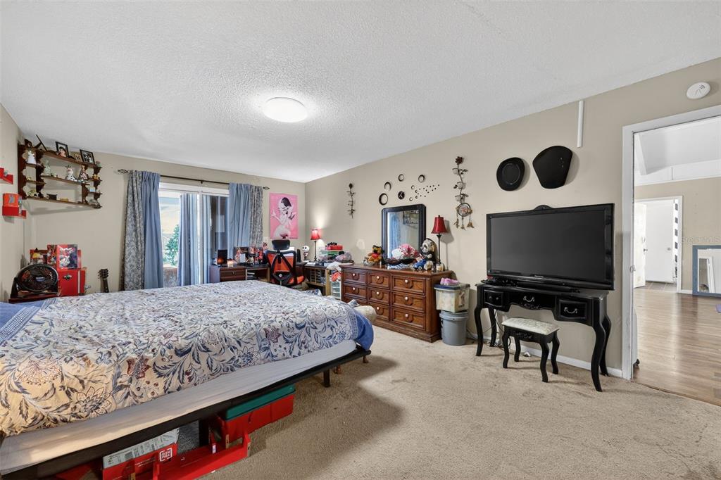 3010 Shepherd Road Mulberry, FL 33860 - Photo 17 of 28 a bedroom with a bed and flat screen tv