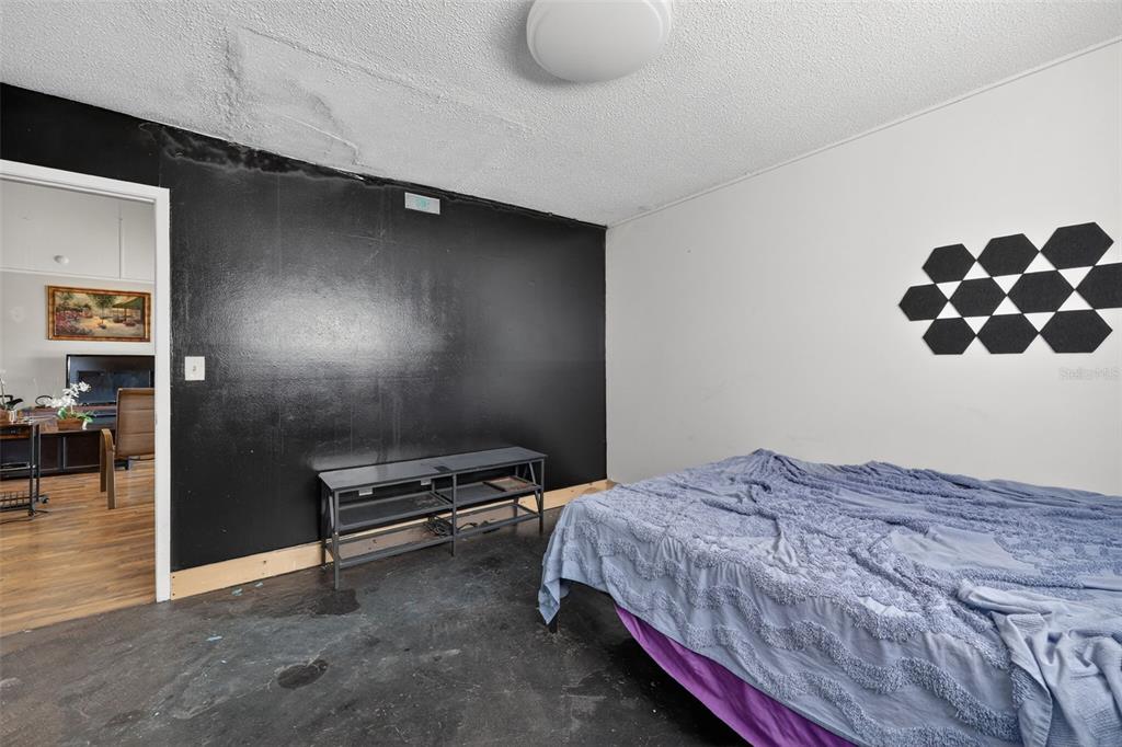 3010 Shepherd Road Mulberry, FL 33860 - Photo 23 of 28 a bedroom with a bed and a chair