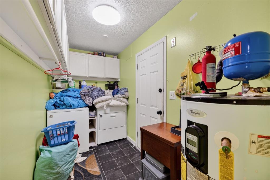 3010 Shepherd Road Mulberry, FL 33860 - Photo 25 of 28 a kitchen with stainless steel appliances granite countertop a sink and a stove