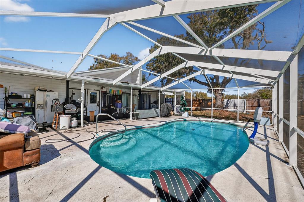 3010 Shepherd Road Mulberry, FL 33860 - Photo 26 of 28 a view of a backyard with swimming pool and sitting area