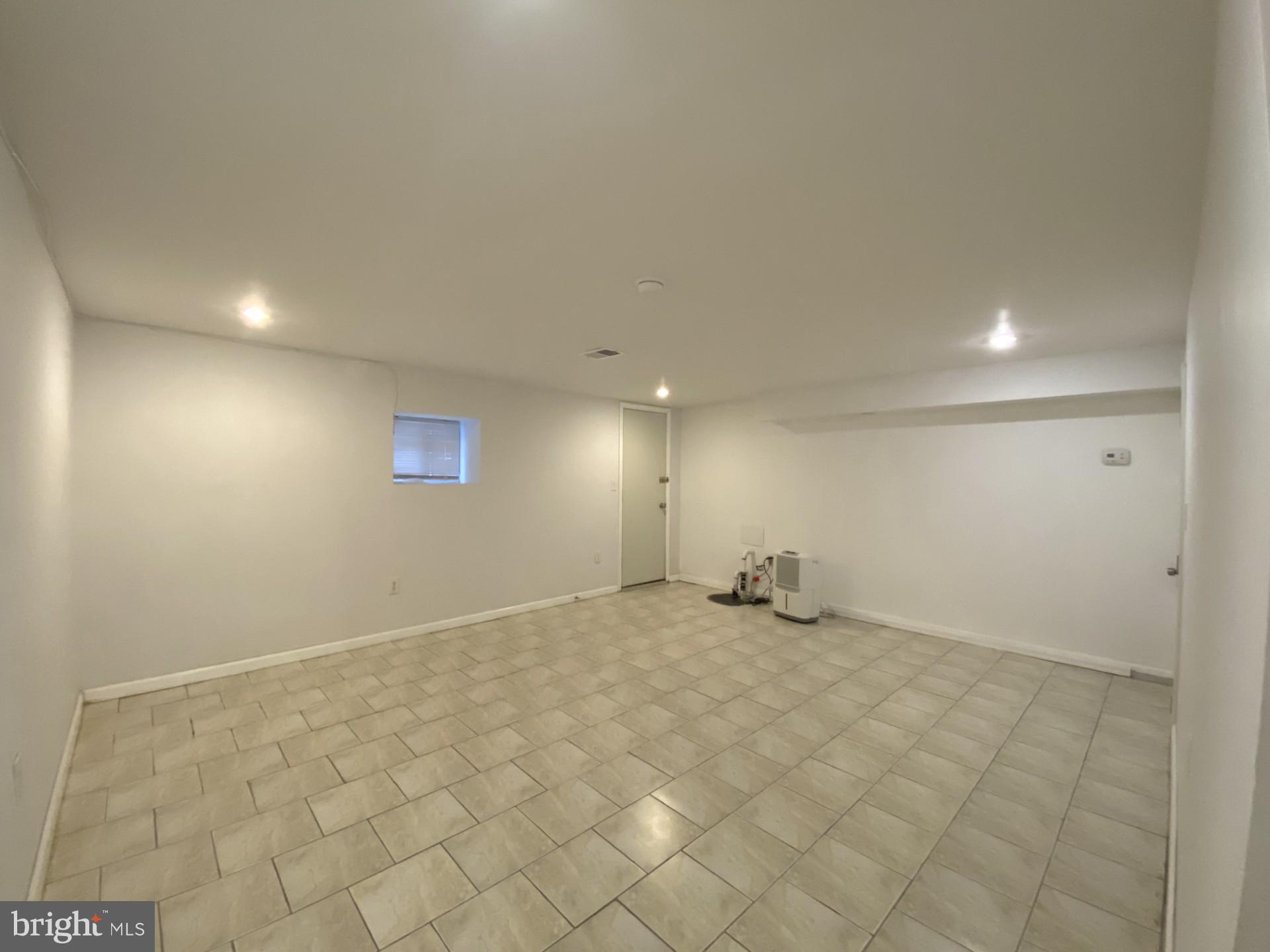 4945 Chestnut Street Philadelphia, PA 19139 - Photo 13 of 27 an empty room with windows