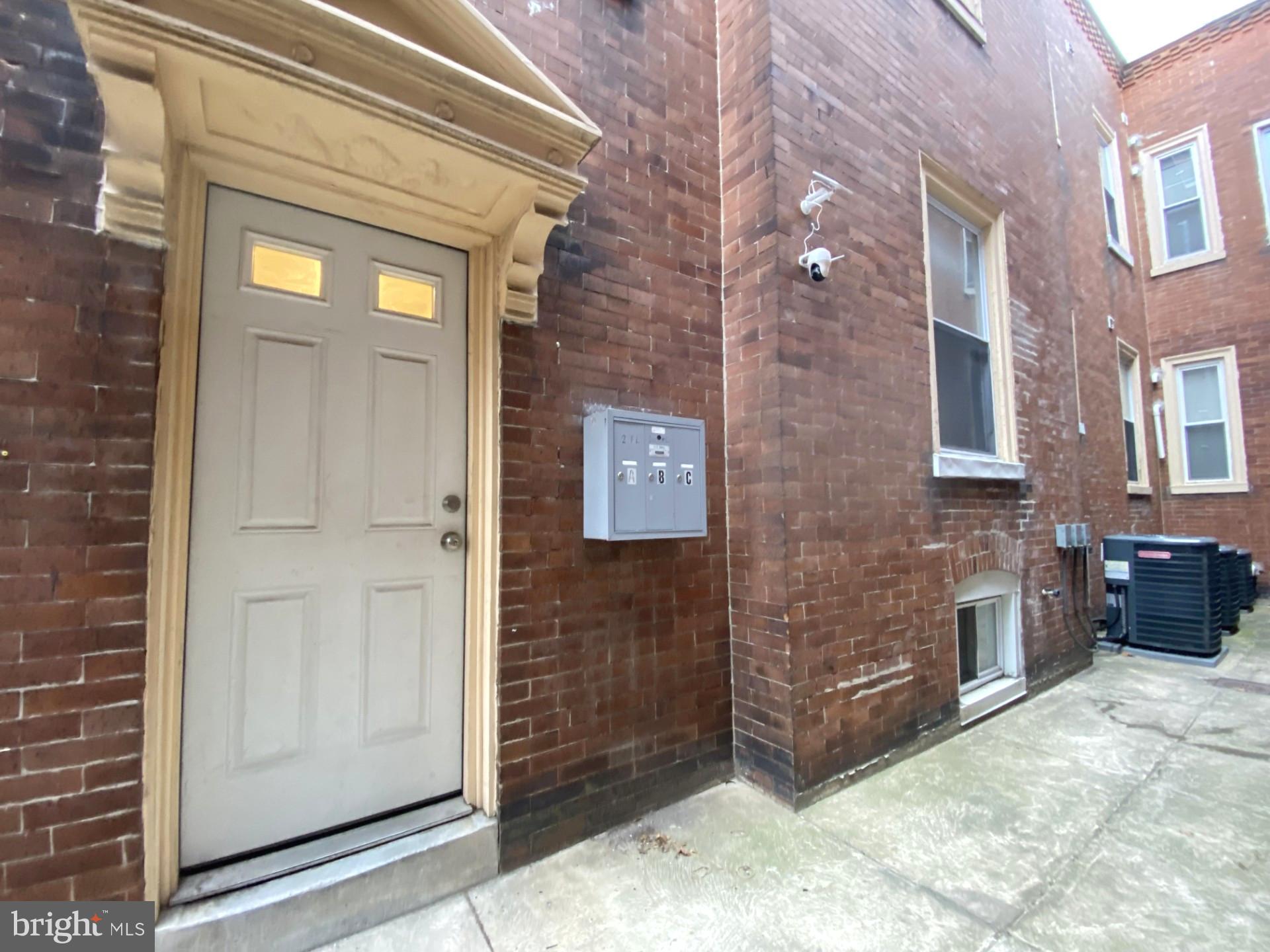 4945 Chestnut Street Philadelphia, PA 19139 - Photo 3 of 27 a view of a brick wall door and an outdoor space