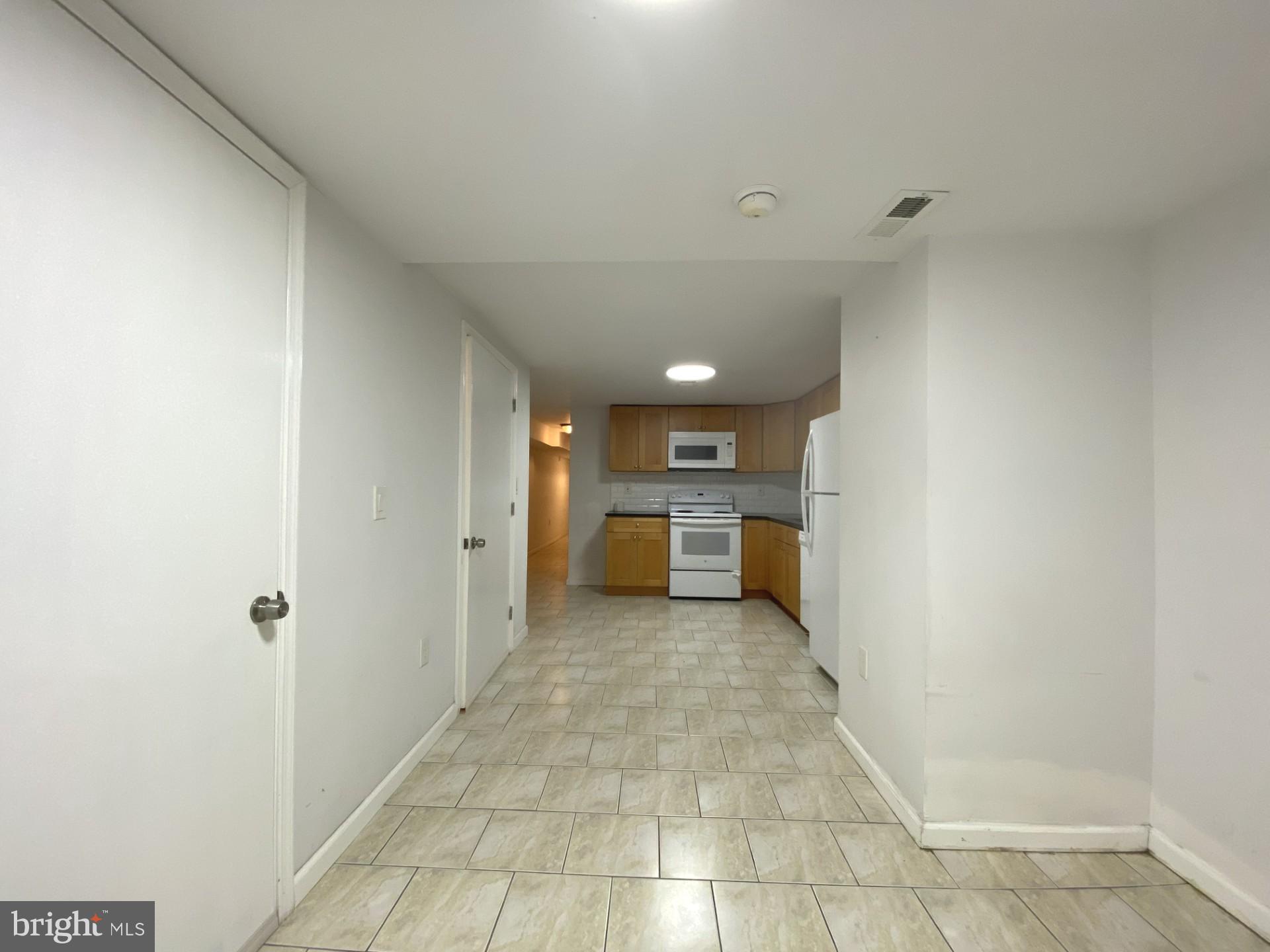 4945 Chestnut Street Philadelphia, PA 19139 - Photo 7 of 27 a view of a kitchen with a sink