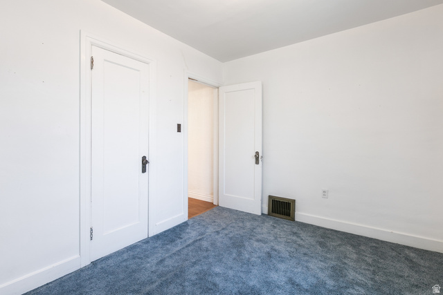 59 East Pinehurst Street Tooele, UT 84074 - Photo 13 of 22 Interior room with light blue carpeting and white walls