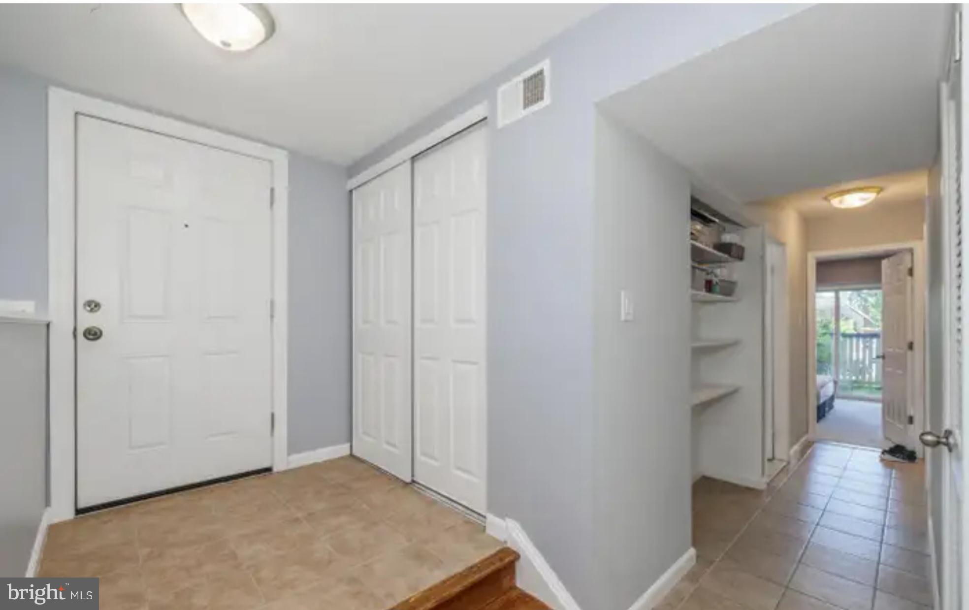 3919 El Soneta Place, Unit 9 Alexandria, VA 22309 - Photo 2 of 17 a view of a hallway with a livingroom and a bathroom