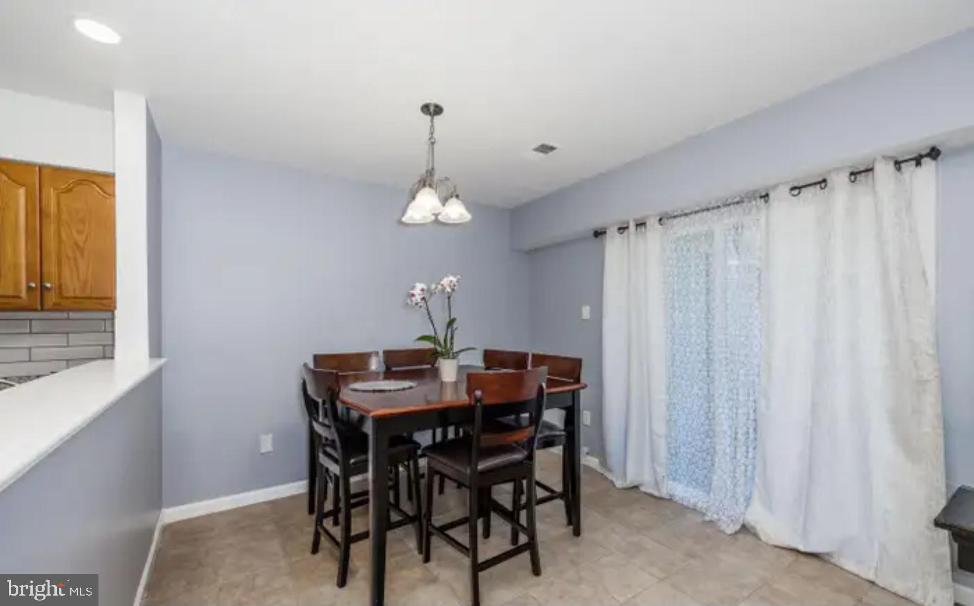 3919 El Soneta Place, Unit 9 Alexandria, VA 22309 - Photo 6 of 17 a view of a dining room with furniture and chandelier