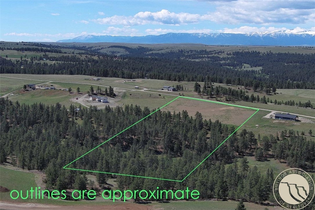 Lot 2 Shane Ridge Road Columbus, MT 59019 - Photo 17 of 20 Aerial overview showcasing the property?s impressive combination of open meadow, mature timber, and breathtaking mountain views. Expansive acreage offers privacy, usable terrain, and a spot to build your home surrounded by Montana?s natural beauty.
