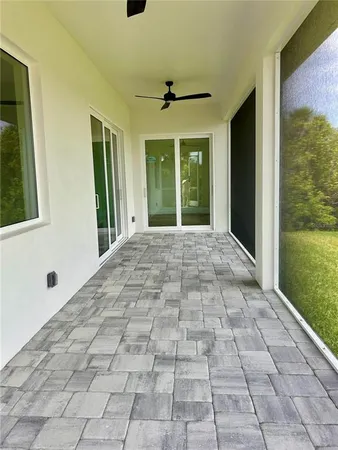 a view of a porch with a floor to ceiling window