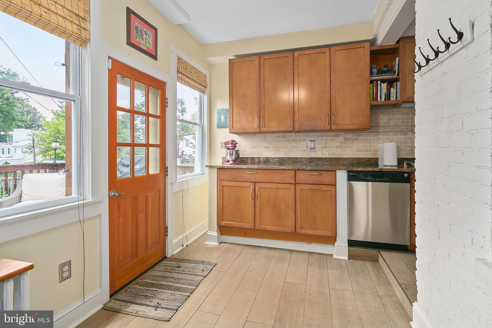 925 K Street Northeast Washington, DC 20002 - Photo 15 of 35 a view of a kitchen with stainless steel appliances granite countertop a stove a sink and a refrigerator