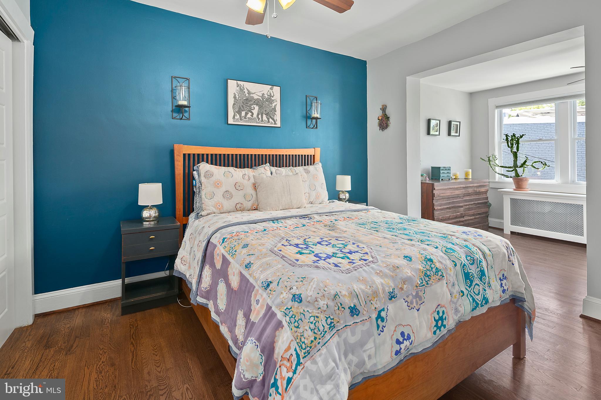 925 K Street Northeast Washington, DC 20002 - Photo 19 of 35 a bedroom with a bed and a large mirror on the dresser