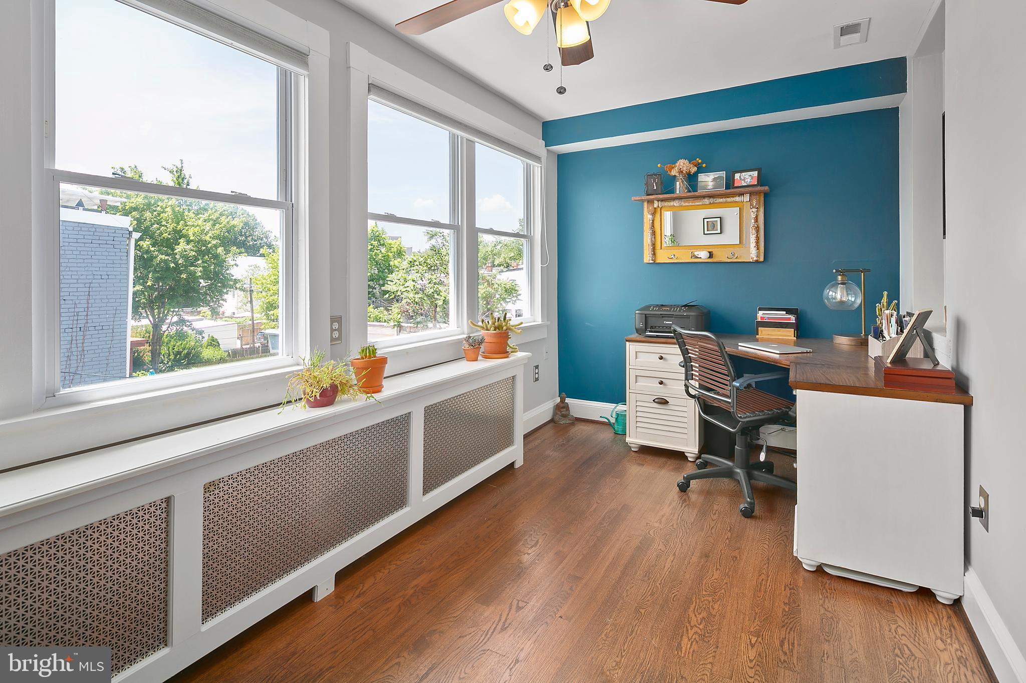 925 K Street Northeast Washington, DC 20002 - Photo 21 of 35 a view of a workspace with furniture and a window