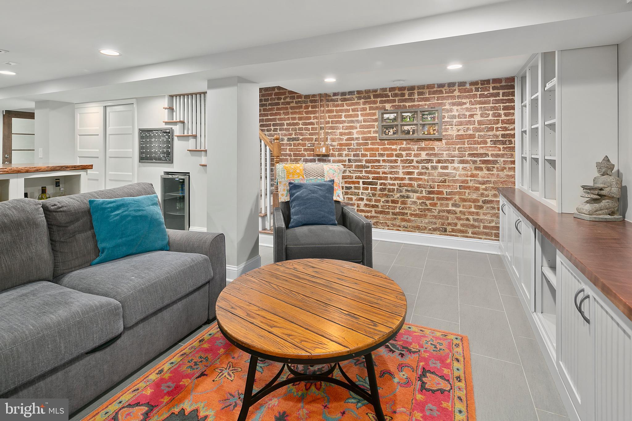 925 K Street Northeast Washington, DC 20002 - Photo 27 of 35 a living room with furniture and a table