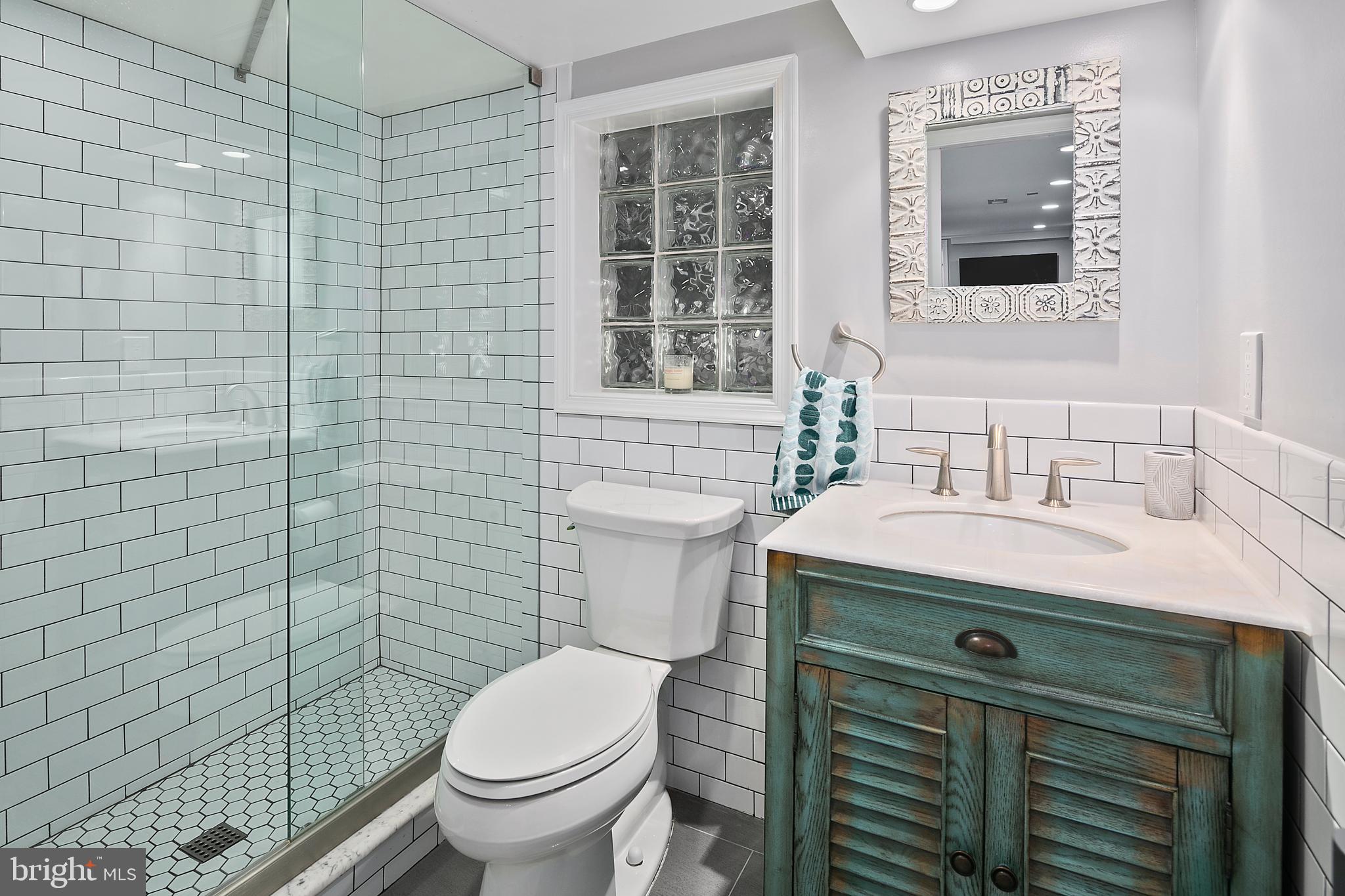 925 K Street Northeast Washington, DC 20002 - Photo 30 of 35 a bathroom with a sink a toilet and shower