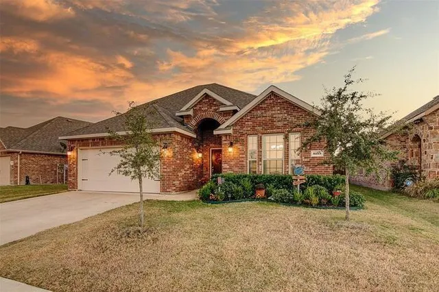 front view of a house with a yard