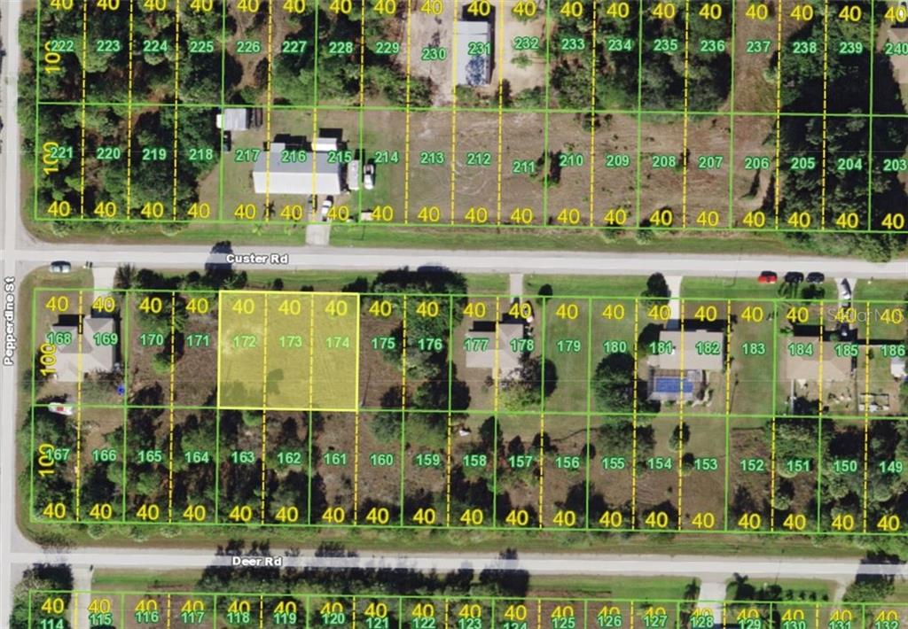 26439 Custer Road Punta Gorda, FL 33955 - Photo 1 of 1 front view of a building with street