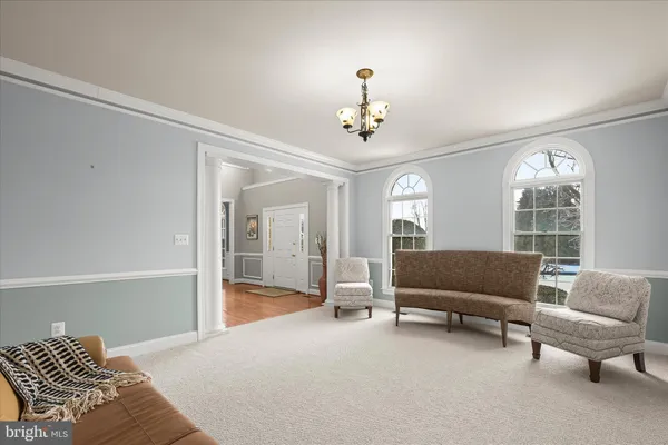 a living room with fireplace furniture and a flat screen tv