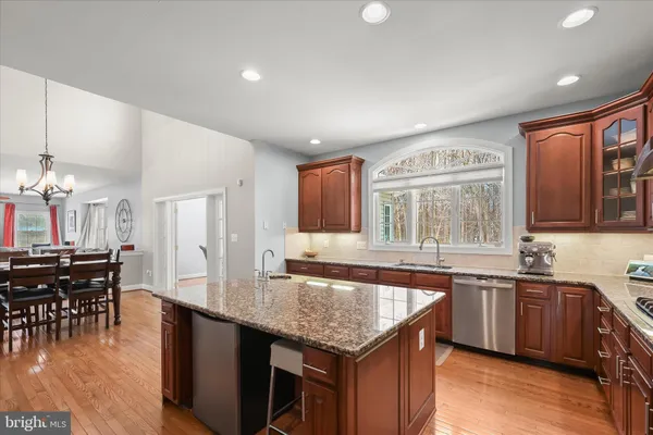 a living room with furniture a window and a flat screen tv