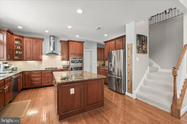 a bedroom with furniture and a book shelf
