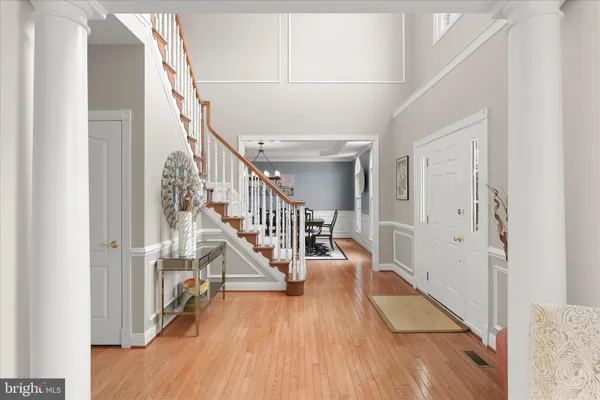 a living room with a couch and a chandelier