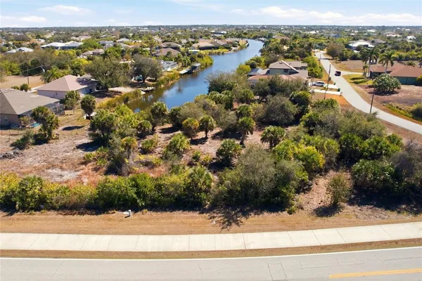an aerial view of residential houses with city view
