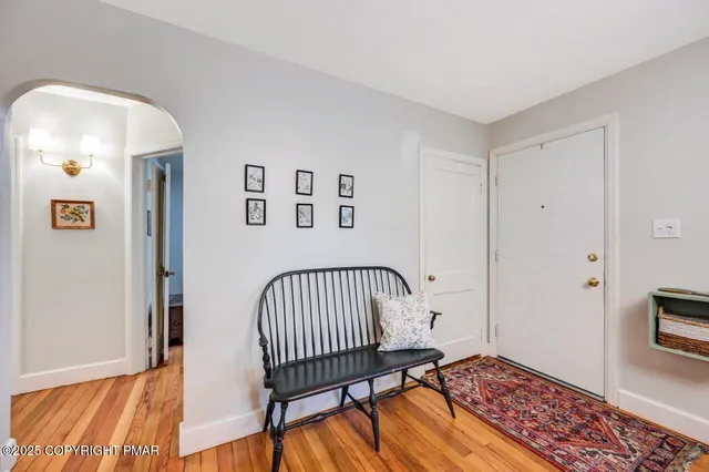 a view of a bedroom with furniture and a window