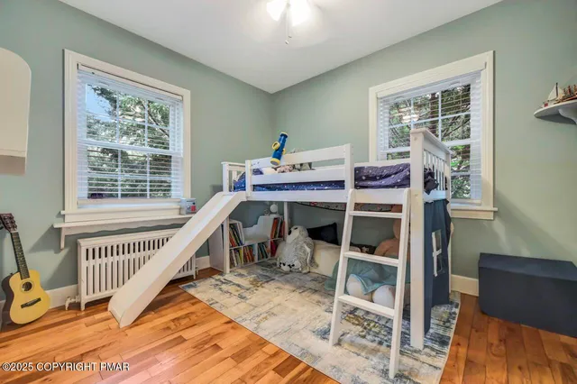 a room with a bed and a table in it