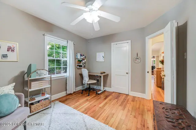 a bedroom with a bed and a chair in it