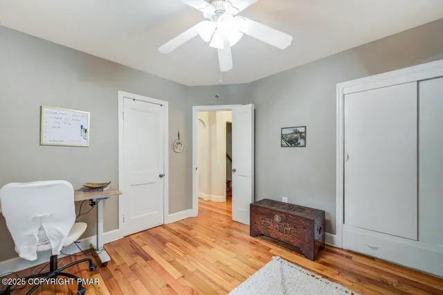 a bedroom with furniture and a window
