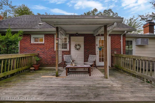 a view of house with outdoor seating space
