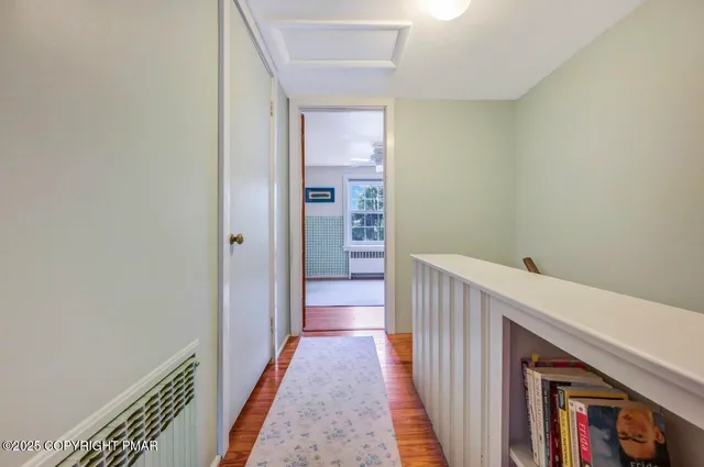 a bedroom with a bed and a book shelf