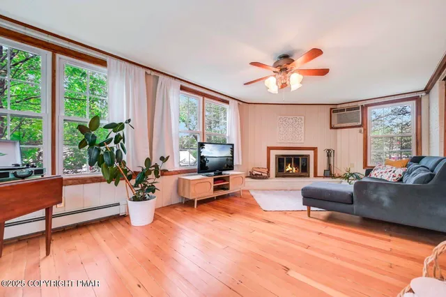 a living room with furniture and a fireplace