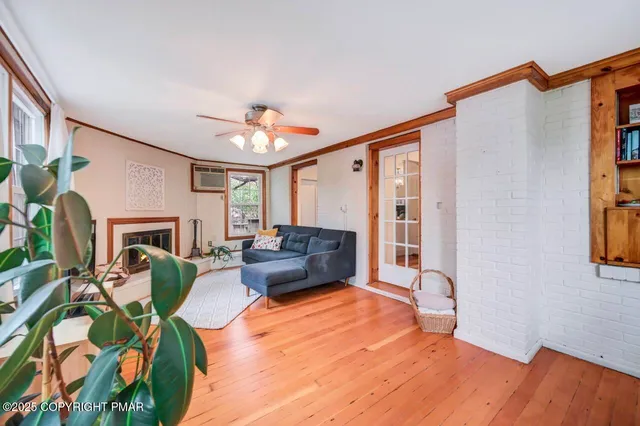 a living room with furniture and a fireplace