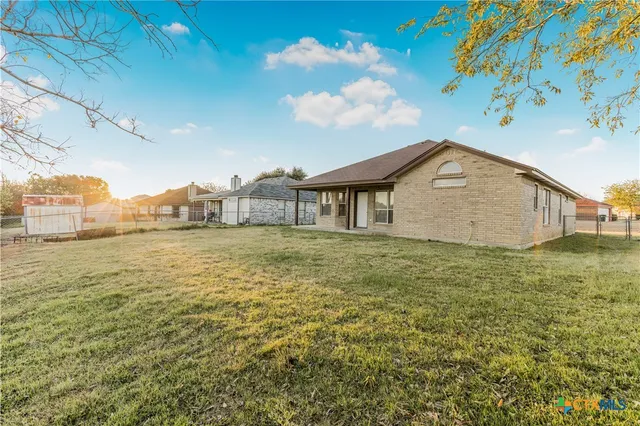 a bathroom with a sink and a yard