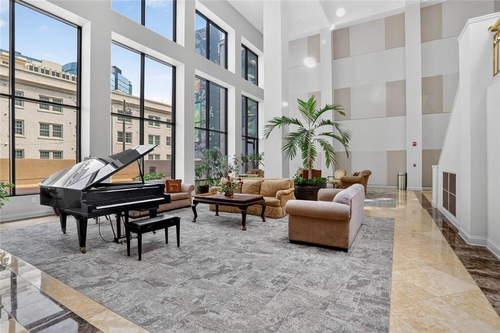 1280 West Peachtree Street Northwest, Unit 3014 Atlanta, GA 30309 - Photo 17 of 33 a living room with furniture and a potted plant