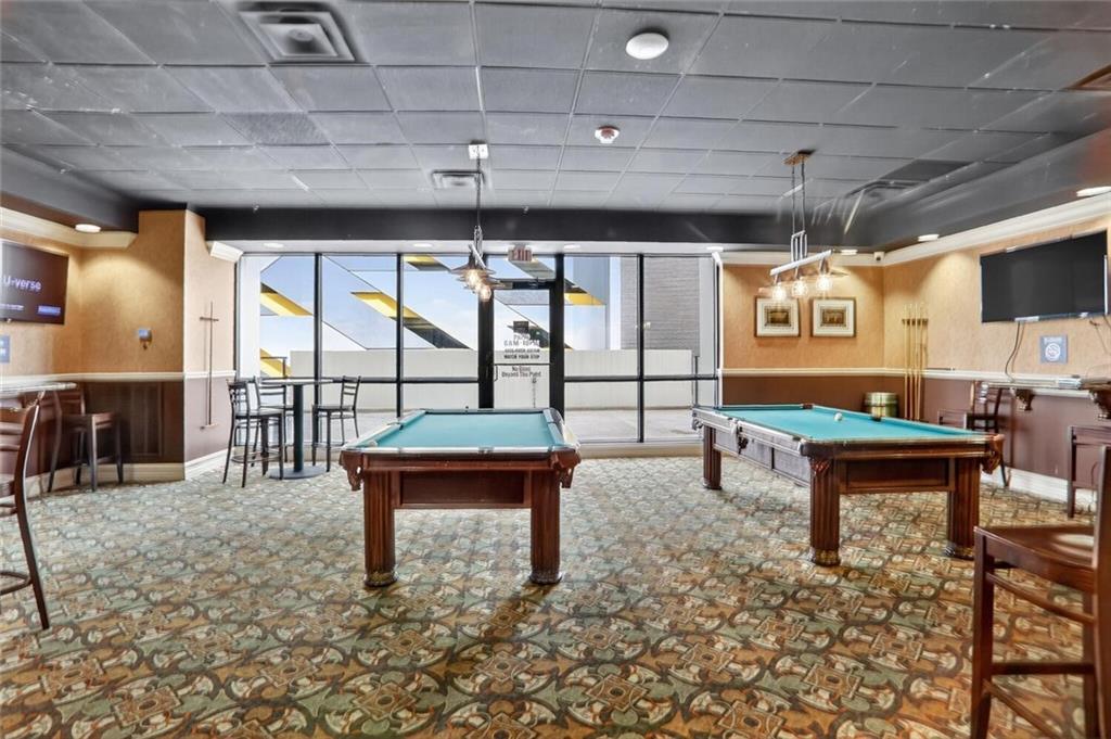 1280 West Peachtree Street Northwest, Unit 3014 Atlanta, GA 30309 - Photo 20 of 33 a reading room with furniture and a rug