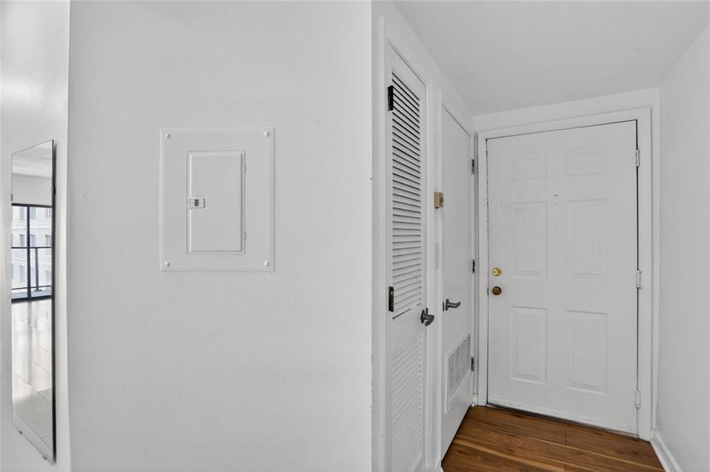 1280 West Peachtree Street Northwest, Unit 3014 Atlanta, GA 30309 - Photo 2 of 33 a view of a hallway with wooden floor