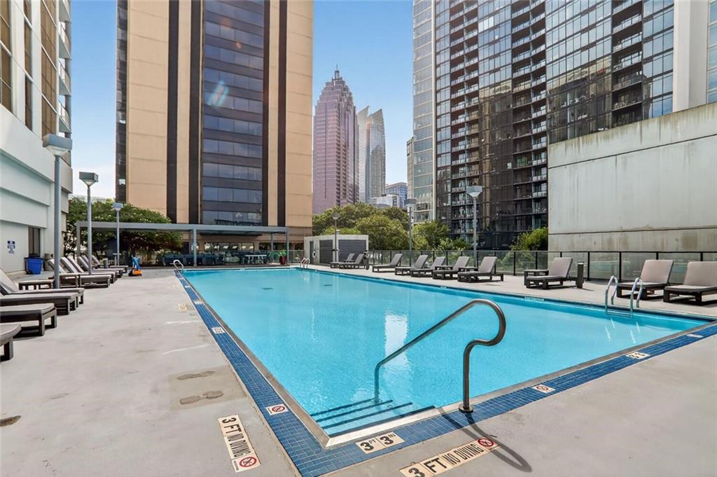 1280 West Peachtree Street Northwest, Unit 3014 Atlanta, GA 30309 - Photo 24 of 33 a view of swimming pool with outdoor seating