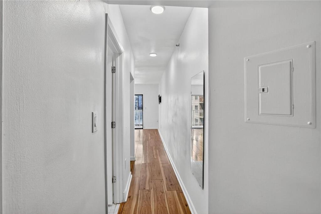 1280 West Peachtree Street Northwest, Unit 3014 Atlanta, GA 30309 - Photo 3 of 33 a view of a hallway with wooden floor and staircase