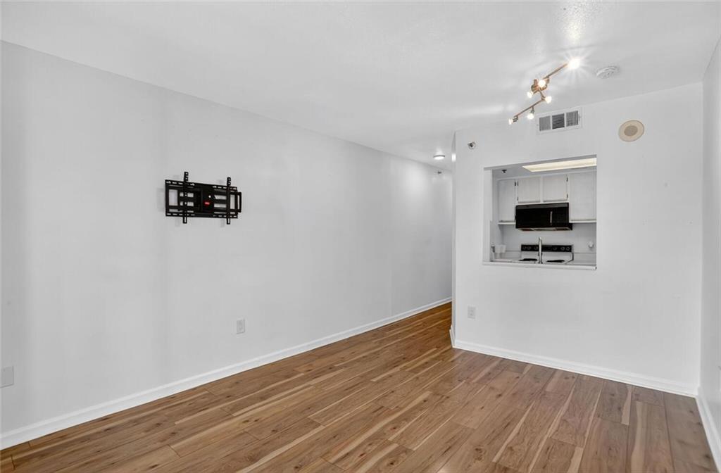 1280 West Peachtree Street Northwest, Unit 3014 Atlanta, GA 30309 - Photo 5 of 33 wooden floor in an empty room