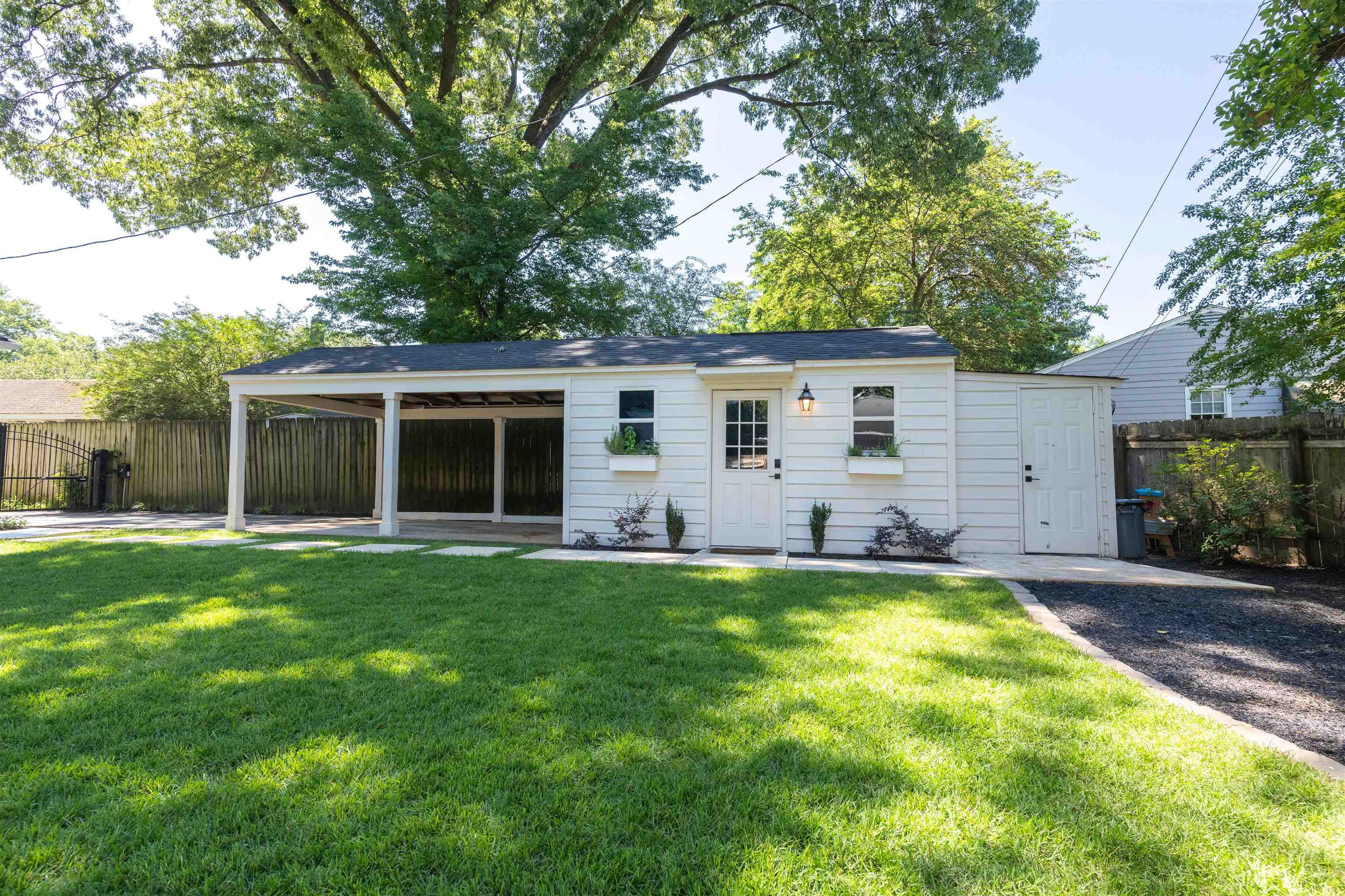 497 East Swan Ridge Circle Memphis, TN 38122 - Photo 27 of 29 Rear view of house featuring a lawn