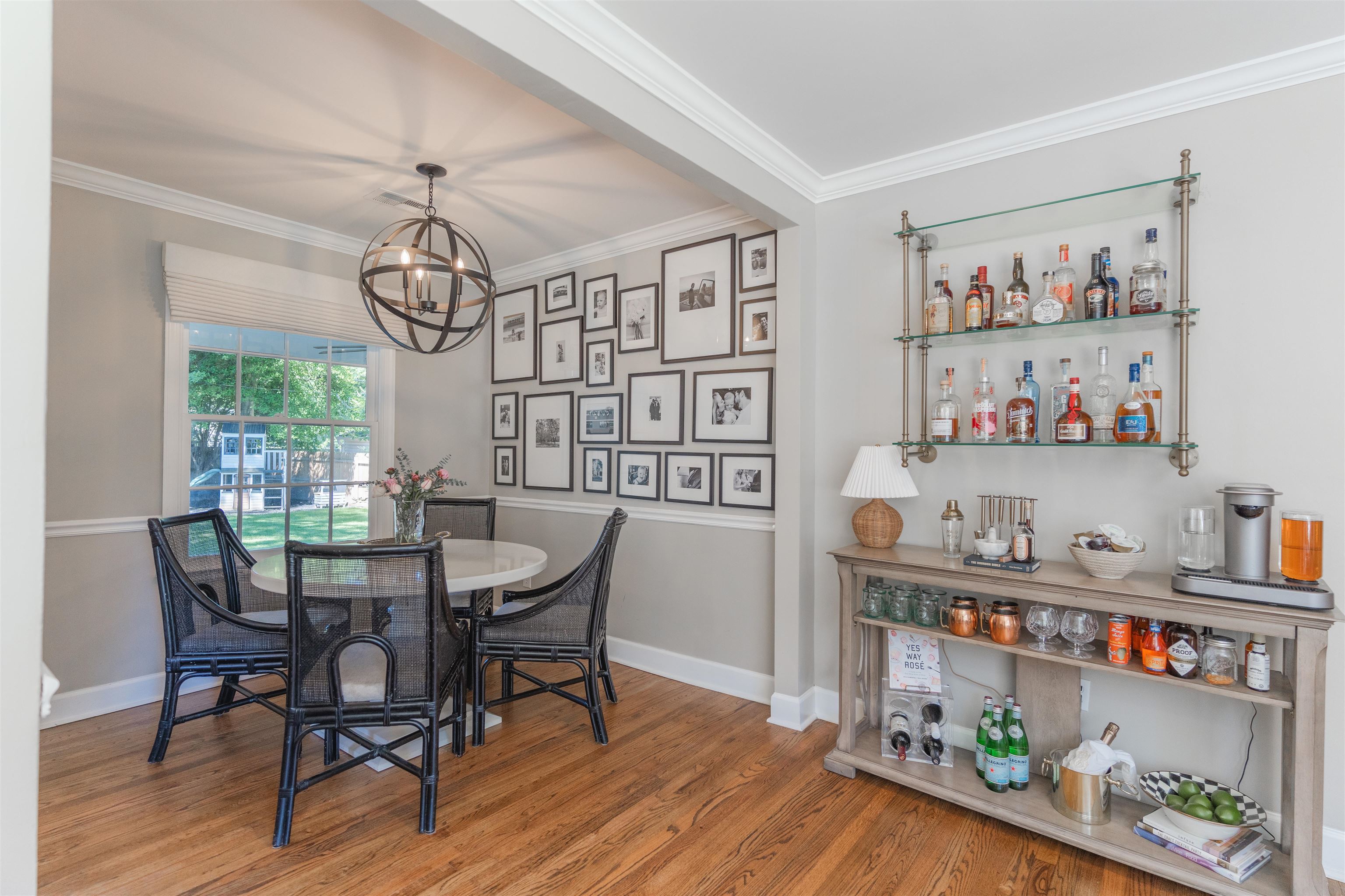 497 East Swan Ridge Circle Memphis, TN 38122 - Photo 5 of 29 Dining area with hardwood / wood-style flooring, a notable chandelier, and ornamental molding