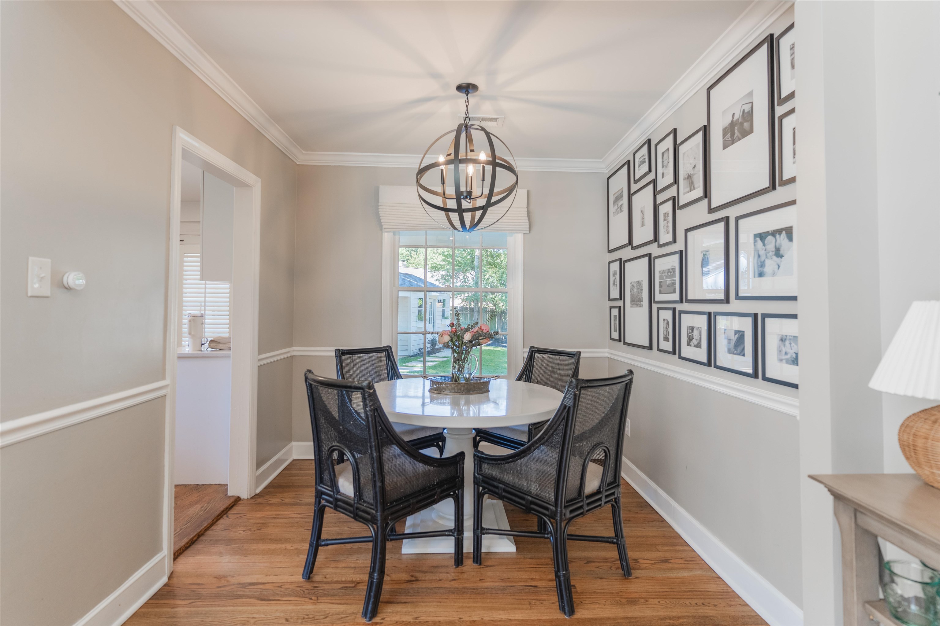 497 East Swan Ridge Circle Memphis, TN 38122 - Photo 6 of 29 Dining room with ornamental molding, light hardwood / wood-style flooring, and a chandelier