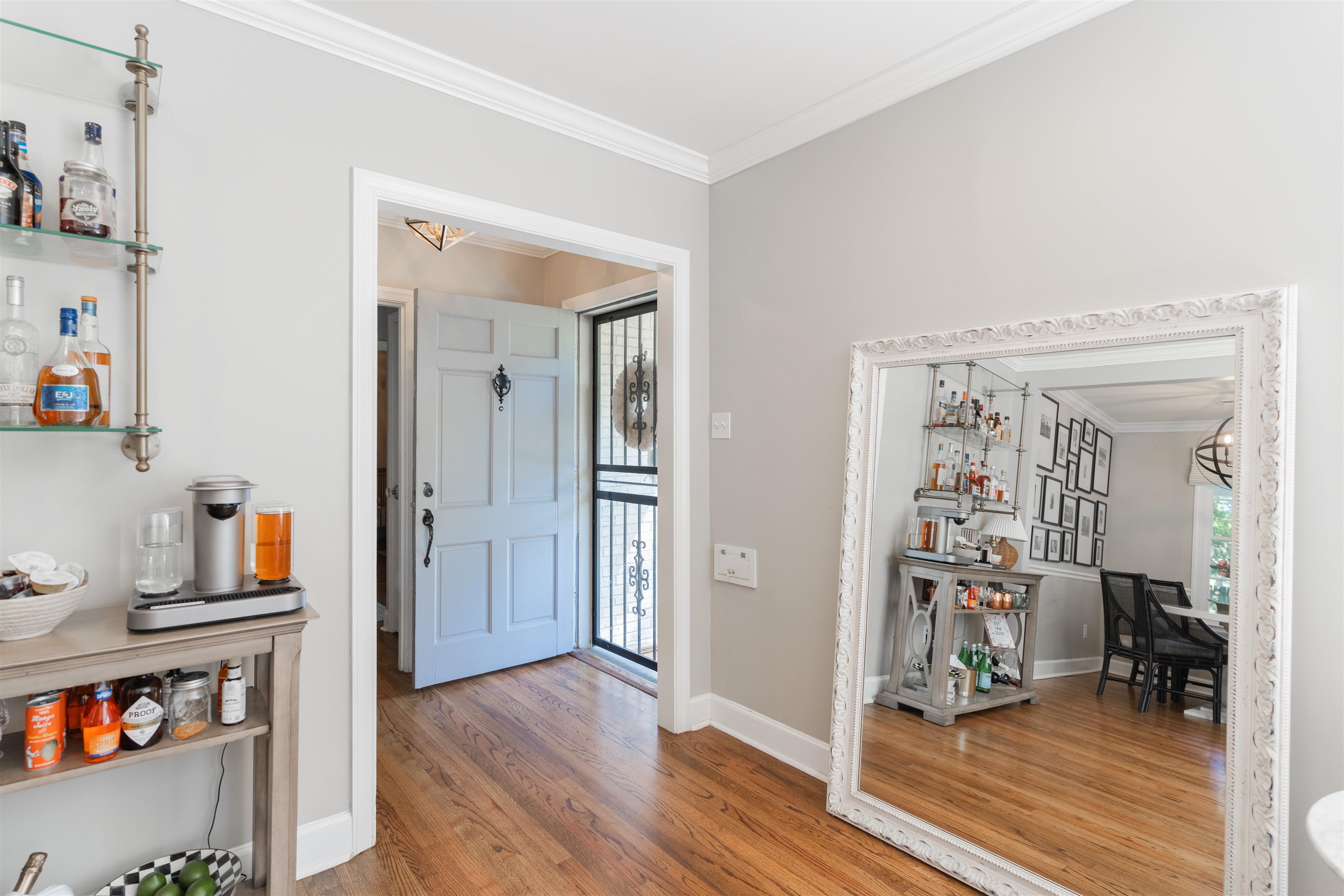 497 East Swan Ridge Circle Memphis, TN 38122 - Photo 10 of 29 Entryway with hardwood / wood-style flooring, a notable chandelier, and crown molding