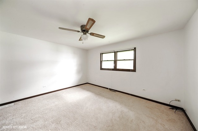 20570 North Clarice Avenue Prairie View, IL 60089 - Photo 5 of 10 a view of an empty room with a window