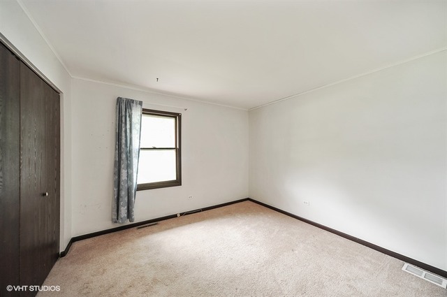 20570 North Clarice Avenue Prairie View, IL 60089 - Photo 7 of 10 an empty room with windows