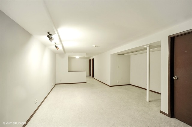 20570 North Clarice Avenue Prairie View, IL 60089 - Photo 9 of 10 an empty room with a empty space and windows
